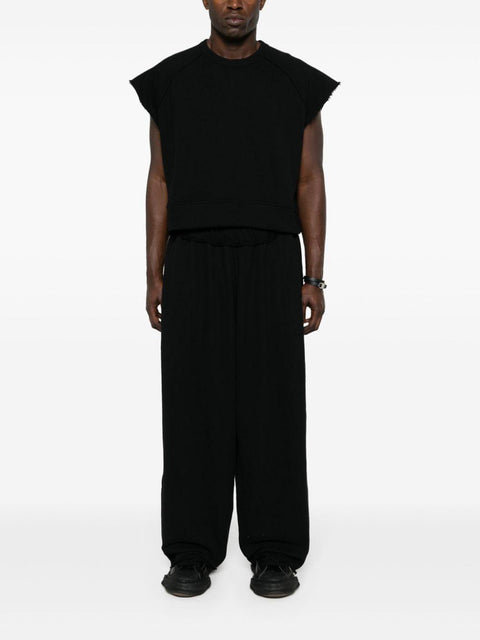 Pantalone con pieghe