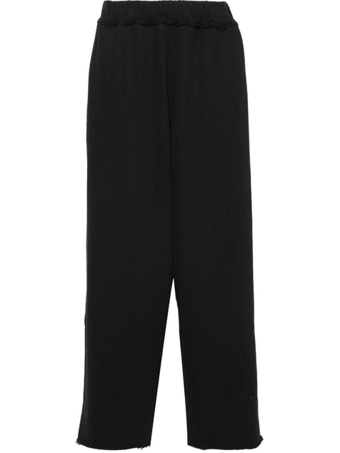 Pantalone con pieghe